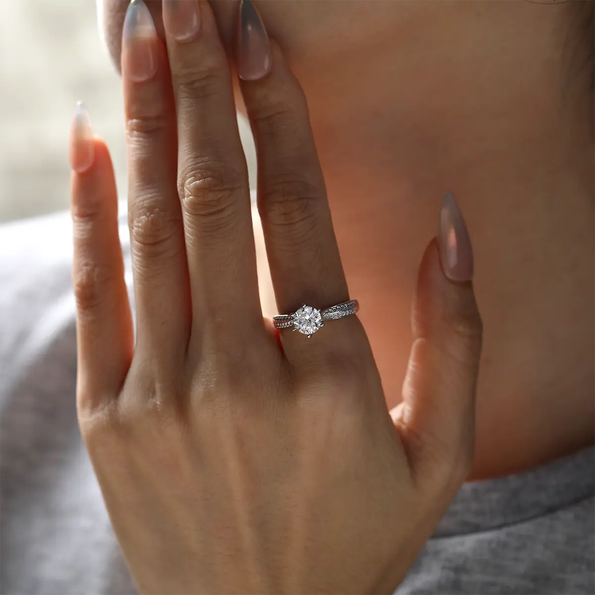 Round moissanite double pave ring, 1 carat center stone, sterling silver with white gold plating.