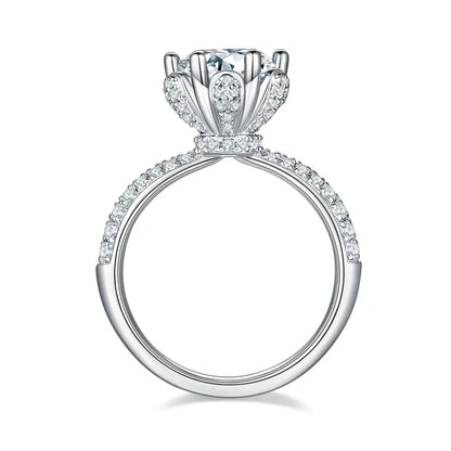 Elegant floral halo ring featuring a 2ct round moissanite and double side stones.