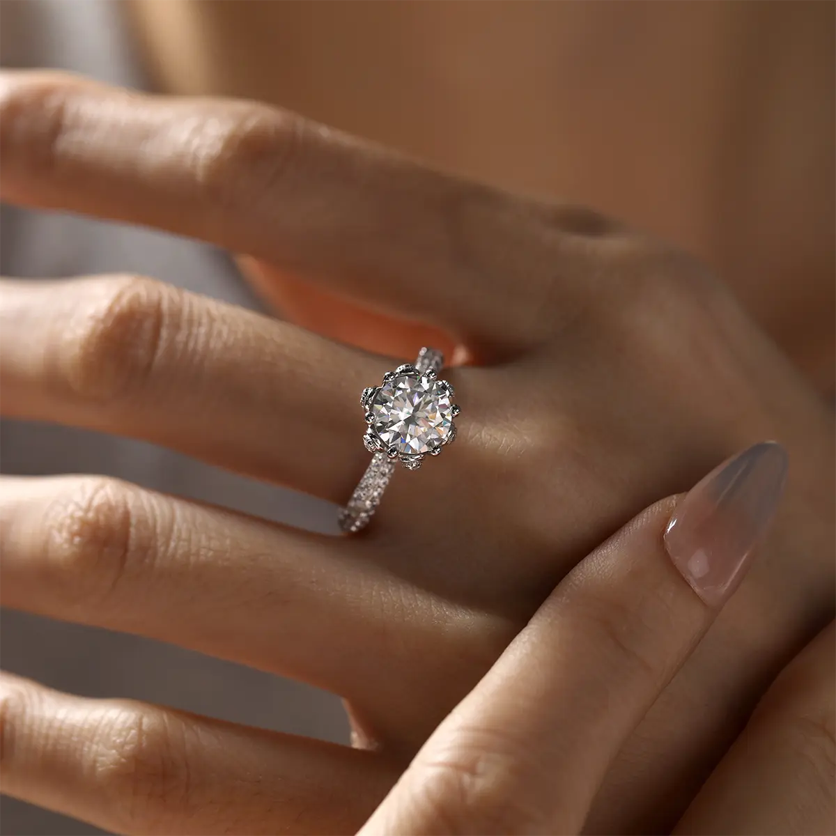 Elegant floral halo ring featuring a 2ct round moissanite and double side stones.