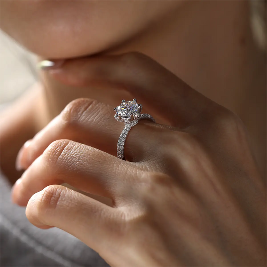 Elegant floral halo ring featuring a 2ct round moissanite and double side stones.