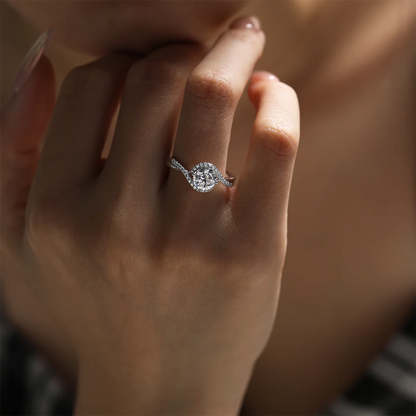 1ct round moissanite twisted band ring in 925 sterling silver with 18K white gold plating, elegant and modern engagement ring design.