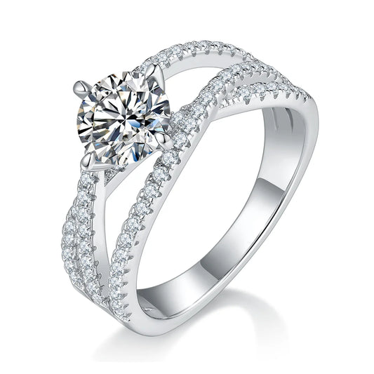 silver moissanite ring with 1ct round center stone and double-row crossover pavé band