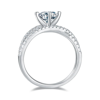 silver moissanite ring with 1ct round center stone and double-row crossover pavé band