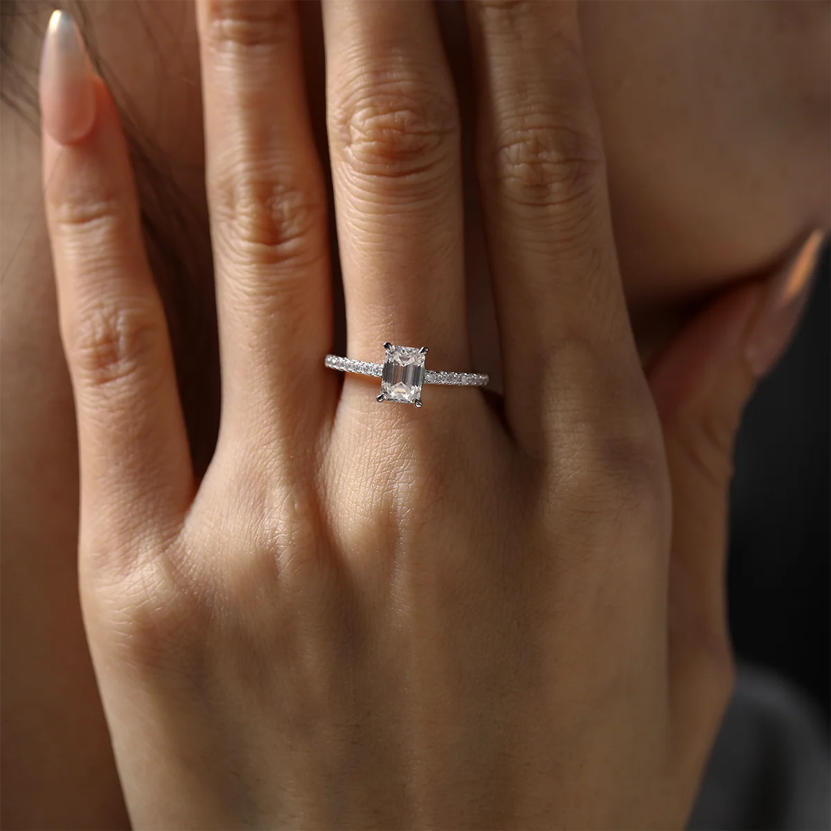elegant emerald cut moissanite engagement ring with pavé accents, silver setting