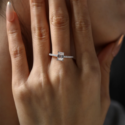elegant emerald cut moissanite engagement ring with pavé accents, silver setting