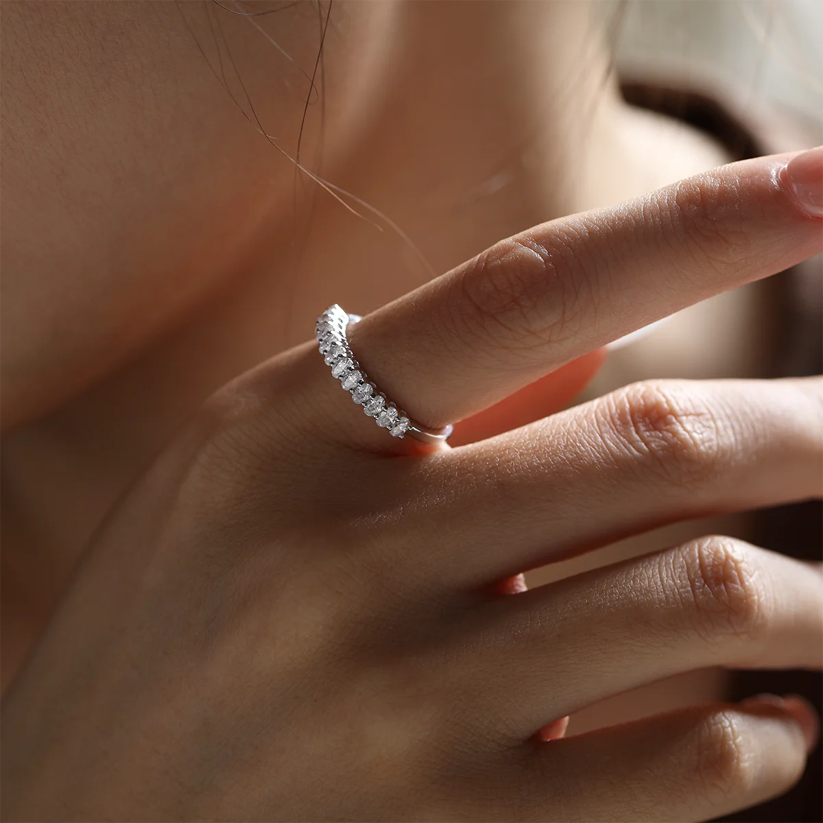 1.0ct Oval Moissanite Half Eternity Ring in 925 Sterling Silver with 18K White Gold Plating, featuring twelve oval-cut moissanites for timeless elegance.