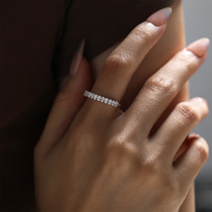 1.0ct Oval Moissanite Half Eternity Ring in 925 Sterling Silver with 18K White Gold Plating, featuring twelve oval-cut moissanites for timeless elegance.