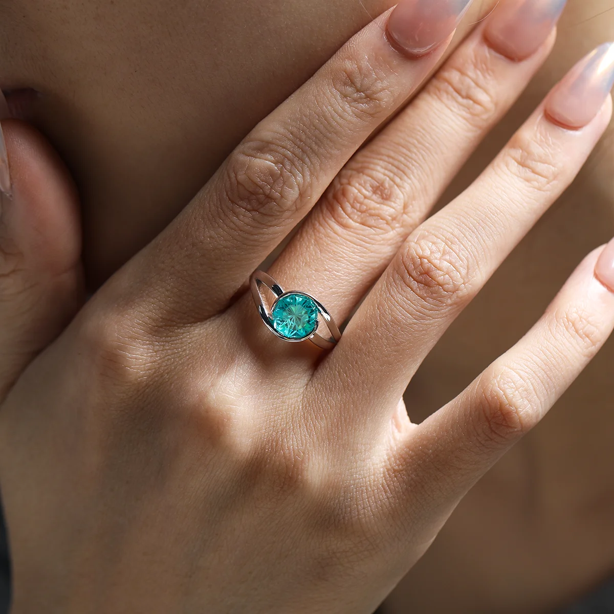 3.5ct Ocean Whisper Sapphire Ring featuring a blue-green synthetic corundum in a nine-sided fancy cut, set in 925 sterling silver with 18K white gold plating and a double-twisted band.