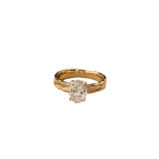 Feather-pattern matte 18K gold ring featuring 1.5ct oval lab-grown diamond