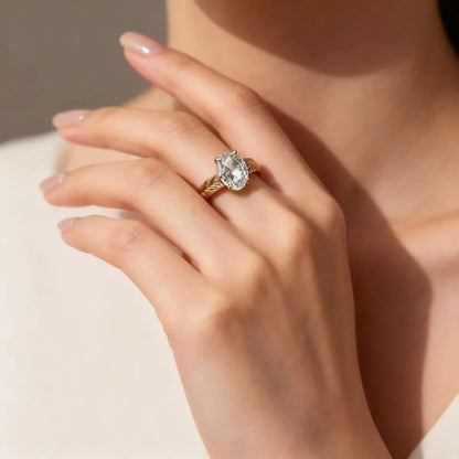 Feather-pattern matte 18K gold ring featuring 1.5ct oval lab-grown diamond