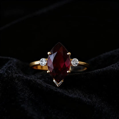 14K yellow gold ring with 1.8ct marquise-cut deep red lab-grown ruby and round cubic zirconia accents