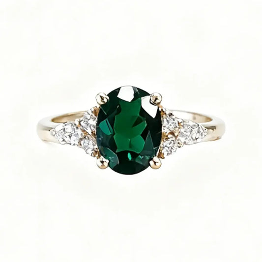 14K yellow gold ring with a 1.6ct oval-cut deep green lab-grown diamond and a slim classic band