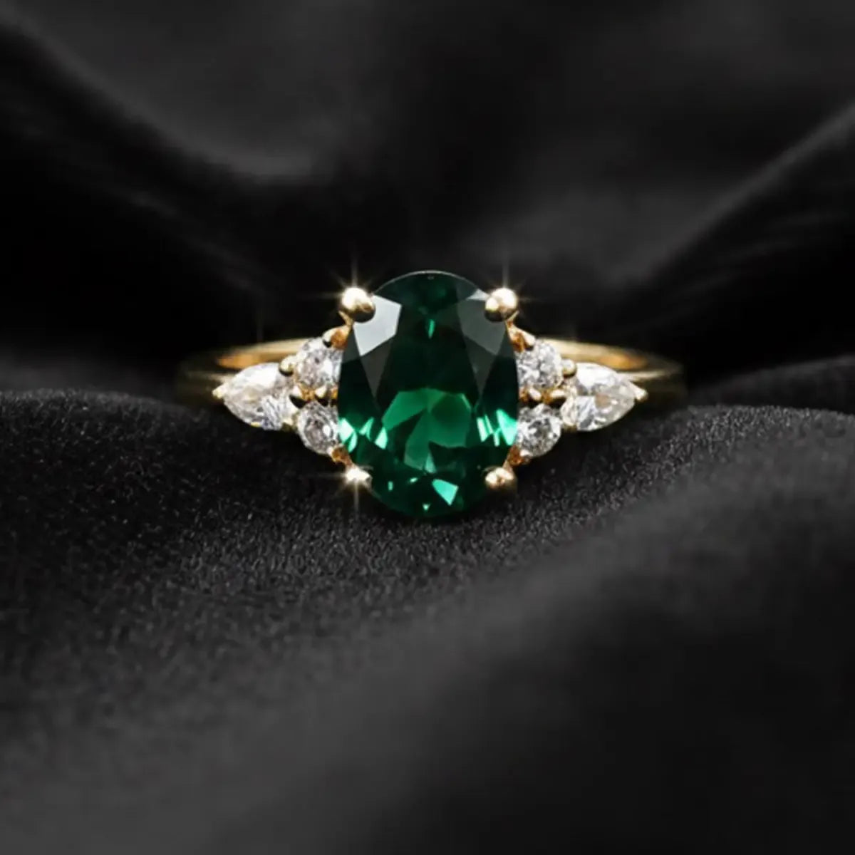 14K yellow gold ring with a 1.6ct oval-cut deep green lab-grown diamond and a slim classic band