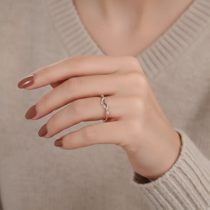 14K rose gold V-shaped stacking ring with delicate lab-grown diamonds, perfect for engagement ring pairing