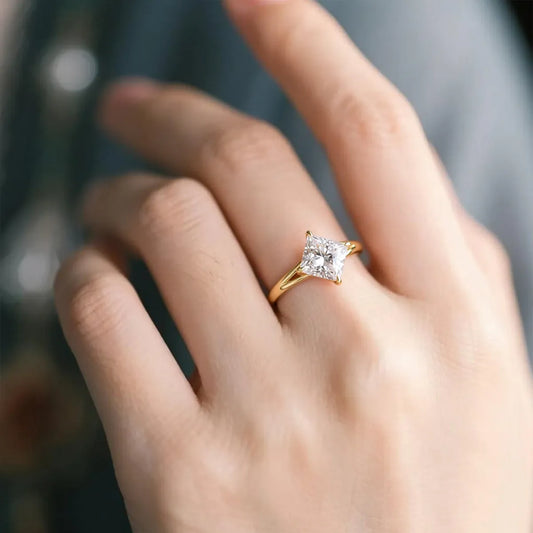 classic princess cut moissanite solitaire ring in 14k gold with four prong setting