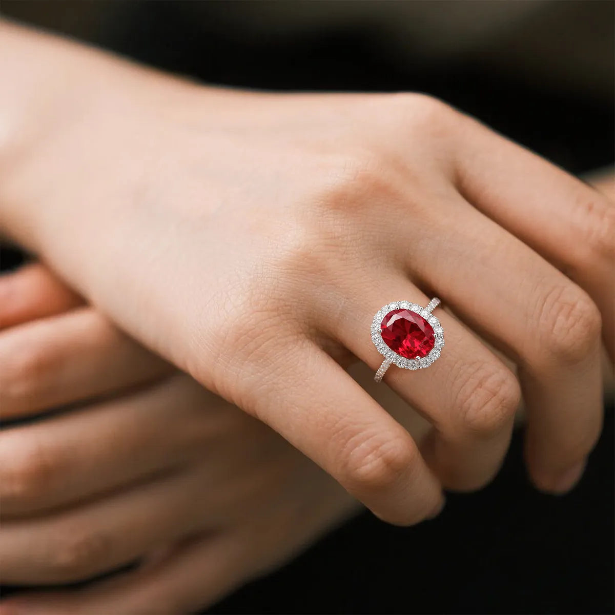 Crimson Glow oval halo ring in 14K white gold featuring a 2.0ct oval-cut red lab-grown diamond with lab-grown diamond pavé band