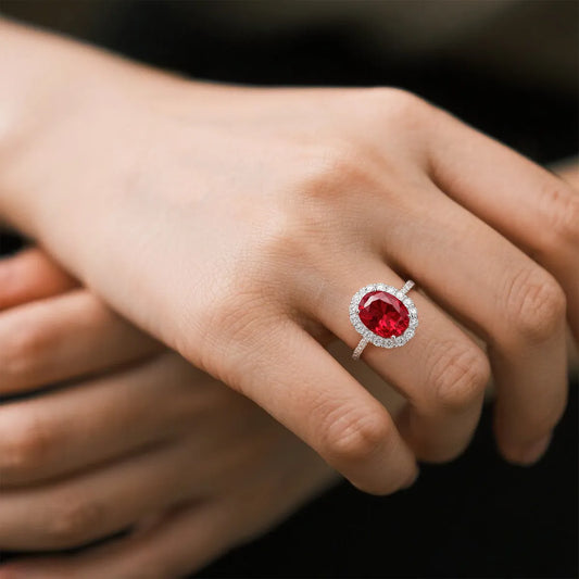 Crimson Glow oval halo ring in 14K white gold featuring a 2.0ct oval-cut red lab-grown diamond with lab-grown diamond pavé band