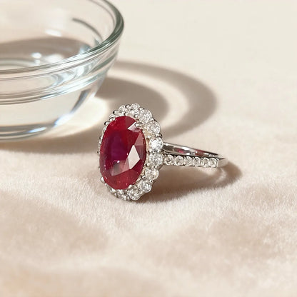 Crimson Glow oval halo ring in 14K white gold featuring a 2.0ct oval-cut red lab-grown diamond with lab-grown diamond pavé band