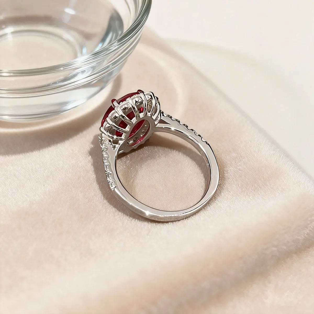 Crimson Glow oval halo ring in 14K white gold featuring a 2.0ct oval-cut red lab-grown diamond with lab-grown diamond pavé band