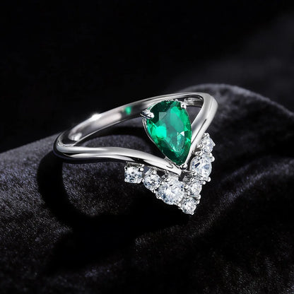 14K white gold V-bypass ring with pear-cut lab-grown green diamond and round white diamond accents