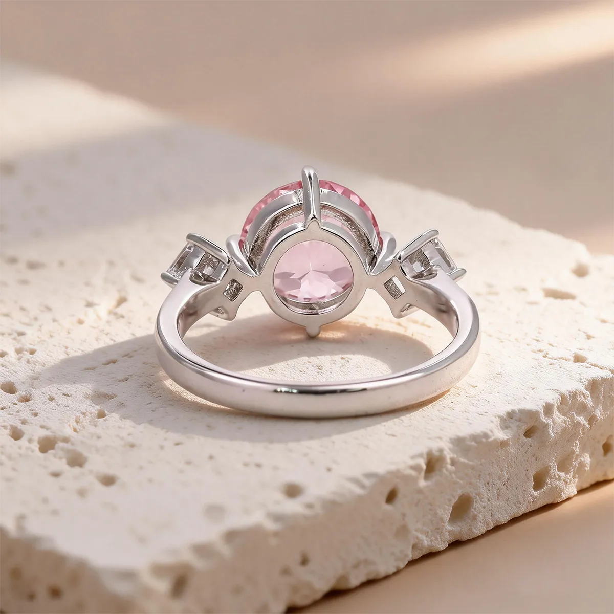 3.55ct round lab-grown Padparadscha sapphire three-stone ring in 925 sterling silver with cubic zirconia side stones, pink peach center stone approx 9mm